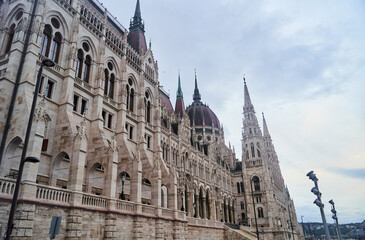 Hungarian Parliament Building in the evening at the Danube river in Budapest, Hungary. High quality photo