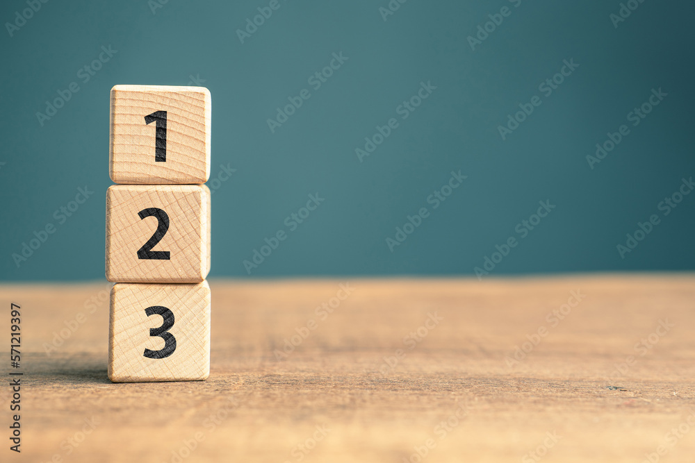 Poster 1, 2, and 3 order numbers stacked by wood cubes with copy space, priority, process, or instruction