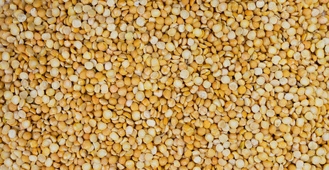 Dry yellow split peas. Banner. Top view. Close-up. Selective focus.