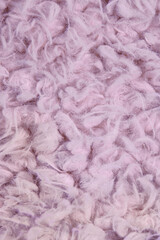 Background formed by pink fluffy textile