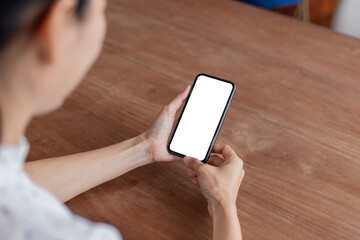 cell phone blank white screen mockup.hand holding texting using mobile on desk at office.background empty space for advertise.work people contact marketing business,technology