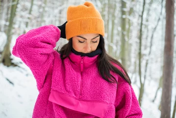 Selbstklebende Fototapeten Pink Young Woman in the Snowy Winter Mountain .Vitosha Mountain ,Bulgaria   © boryanam