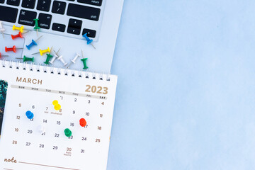 Push pin marks on March 2023 month Calendar 