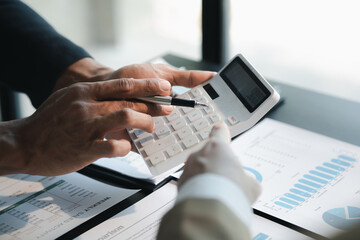 Financial business plan meeting Take notes in a notebook with a pen and analyze data with reports, data graphs and calculators for efficient, intuitive and efficient work.