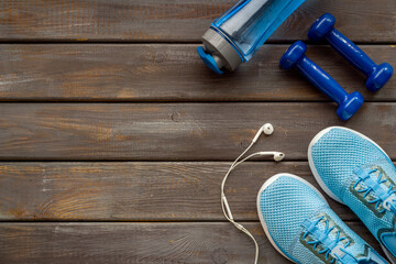Gym and fitness equipment with sneakers and dumbbells