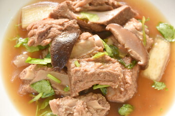 boiled pork bone with Chinese herb stew on plate