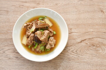 boiled pork bone with Chinese herb stew on plate