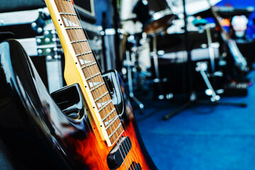 A fragment of an electric guitar against the backdrop of a concert venue. Preparation for a musical...