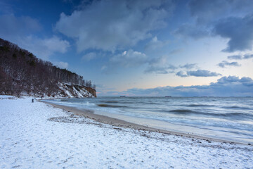 Beautiful landscape of the cliff in Gdynia Orłowo in snowy winter, Baltic Sea. Poland