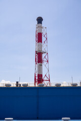 Landscape photo of chimney and stack of combine cycle power plant project. The photo is suitable to use for industry background photography, power plant poster and electricity content media.