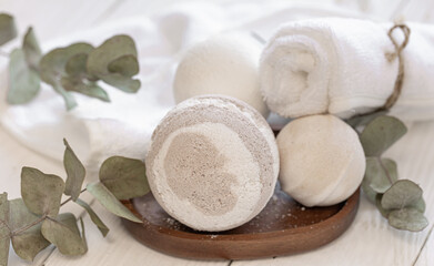 Spa composition with bath bombs and towels, close-up.