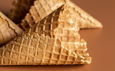 Close-up of waffle cones, creative macro concept of sweets and food.