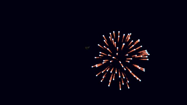 glowing fireworks lights sky. golden background abstract firework. new year eve show night. resolution seamless loop celebration multicolor. blur bokeh display real shining colorful year.
