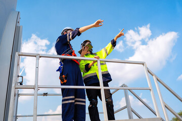 Wind turbine service engineer stand on platform plan for maintenance electricity generator