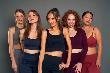 Portrait of five women in sports clothes in studio shot