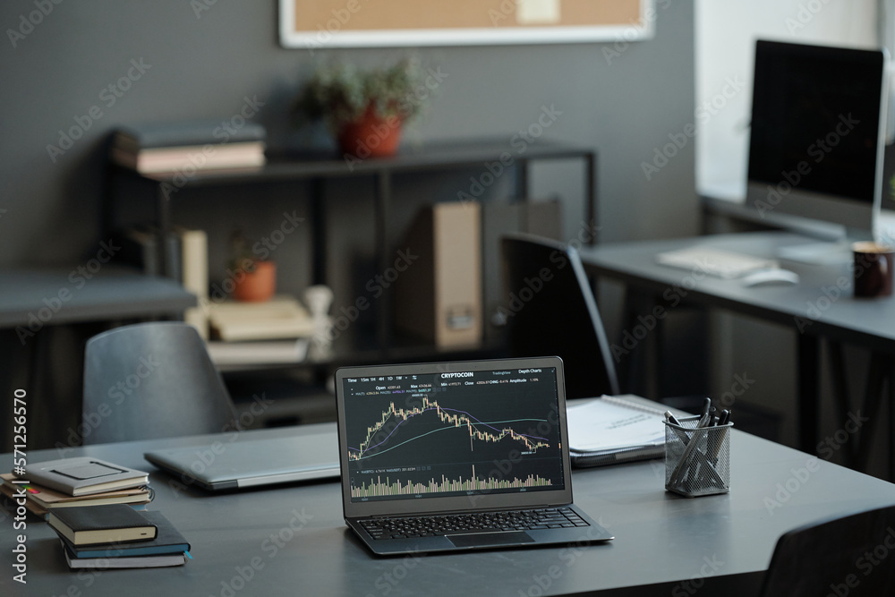 Aufkleber workplace of stock market analyst with graphic data illustrating fluctuations on screen of laptop st