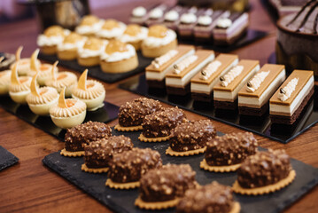 Pastry shop display window with a variety of cakes.
