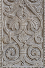 Antique carved stone bas-relief with a floral pattern