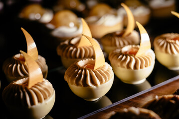 Fashionable mousse cake in white chocolate. French dessert. Mini carrot cake