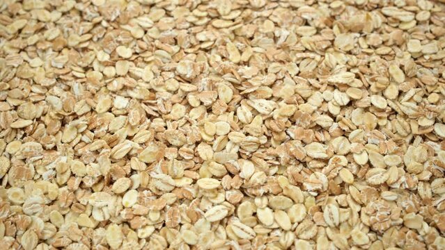 Raw oatmeal close up, slider shot