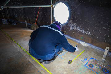 Male worker inspection floor scan tank external floating of rust  wall lose thickness bottom plate...