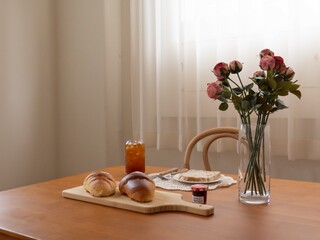 bread coffee iced americano croissant rose table
