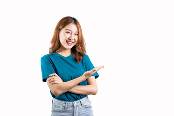 Asian woman in blue shirt standing on white background making hand gesture