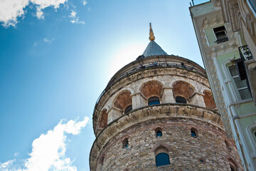 View of the famous fourteenth-century Galata Tower inside the historical district - Istanbul - Turkey - Image with copy space