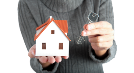 Miniature house and keys. concept of buying or selling home