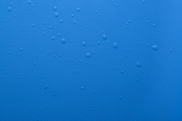 Water drops on blue color  surface