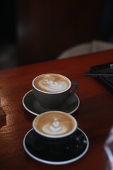 latte art on the wood table in the coffee shop