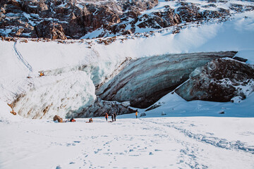 Beautiful ice cave in glacier. Winter mountain landscape.