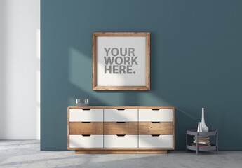 Square wooden poster Frame Mockup hanging above chest in room