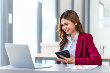 Young pretty business woman bookkeepers online consult on laptop with stock market earning and profit, tax, yearly planning, Powerful expert management complete bookkeeping service and solutions