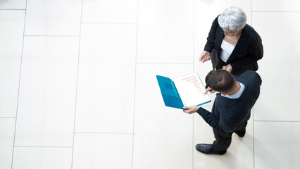 Business people conversing in office lobby