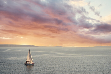 Sunset Seascape with white yacht sailing the sea - obrazy, fototapety, plakaty