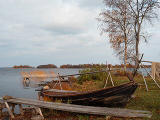 Naklejka na ściany i meble Antique fishing gear, boats and nets for fishing in Lake Onega, historical Museum on Kizhi Island, Karelia, northern Russia.