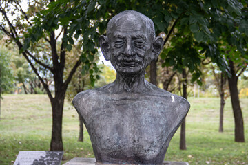 Fototapeta na wymiar Monument of Mahatma Gandhi, creator of non violent resistance, placed in public park in Belgrade, Serbia