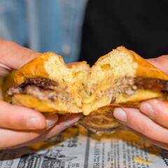 Smash burguer with blurred background, bbq, cheese, brioche