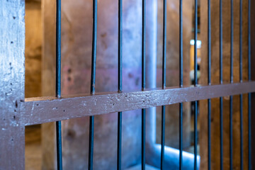 Old prison with bars locked up, Prisoner steel cage, Prison cell with jail iron bars for criminals