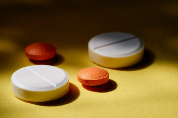Obraz na płótnie Canvas Medicine and drug concept. Pharmacy and health care. Close up of different tablets on yellow background.