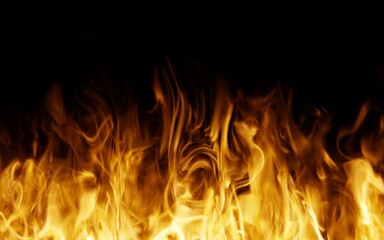 Fototapeta premium Fire flames on the black background. Fire isolated.