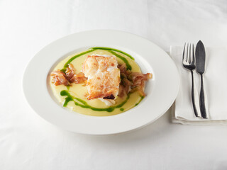 cod dish with creamy sauce and caramelized onions