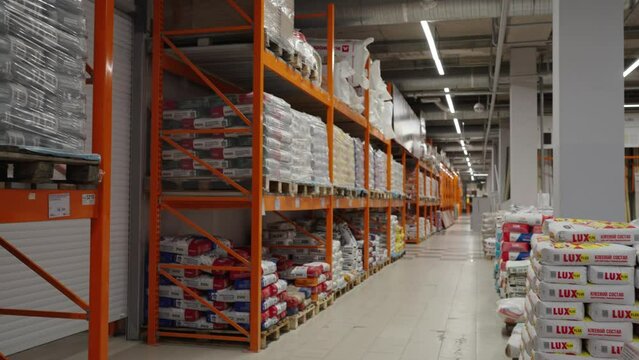 Large selection of building materials are sold in a hardware store. Warehouse for wholesale and retail trade in building materials. Goods for construction and repair.