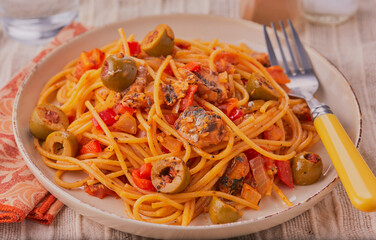 Sardines and spaghetti in tomato sauce.