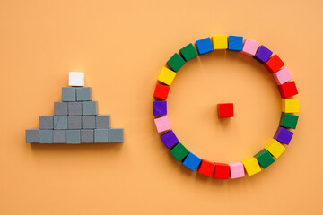 Cubes creating circle and pyramid as different management styles.