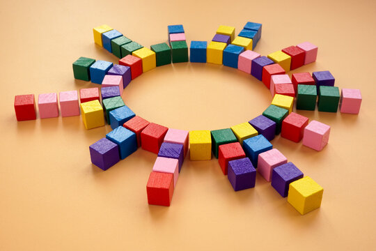 A circle of colored cubes as an abstract concept of interaction, management and connections.