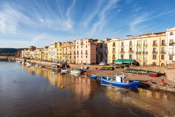 River with Homes and Apartments in Touristic Town. Bosa, Sardinia, Italy. Sunny Fall Season Day. Panorama
