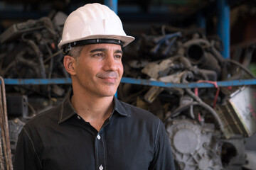 Engineers or technicians are inspecting auto parts in warehouses and factories. The man holding a flip chart in parts warehouse.
