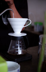 pour water into coffee using the v60 method